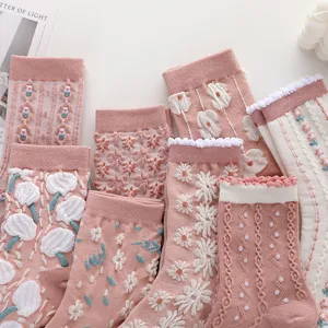 Cute pink mid tube socks for women, retro floral 3D embroidered knit casual long hosiery styles.