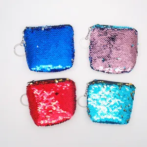 Detailed close-up shot of four colorful sequin coin purses featuring secure metal keychains.