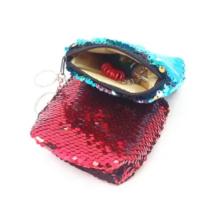 Cute mermaid reversible sequin coin purse with zipper closure and keychain pendant.