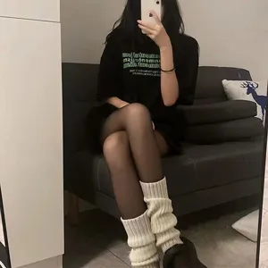 Detailed shot of cozy knit leg warmers for women, autumn winter warm stack socks stylish daily wear.