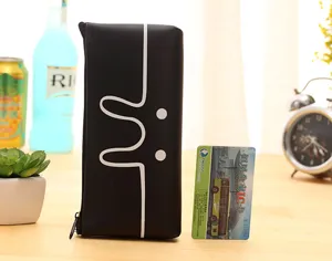 Detailed view of black PU leather pencil case with cute minimalist rabbit graphic and white zipper.