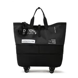 Detail view of the large 73L rolling travel bag showing sturdy wheels, straps, and branding.