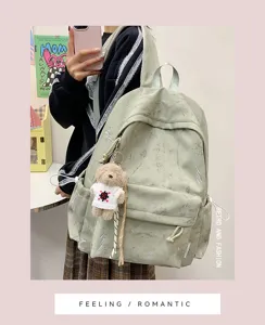 Green aesthetic backpack with lightning pattern and cute bear keychain for school