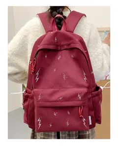 Wine red schoolbag with white lightning bolt pattern, large capacity for students