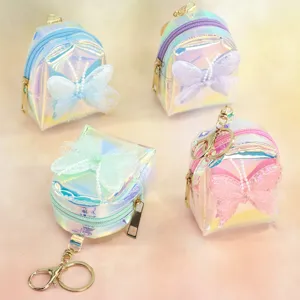 Holographic mini backpack keychain with butterfly bow, cute coin purse and earphone case detail.