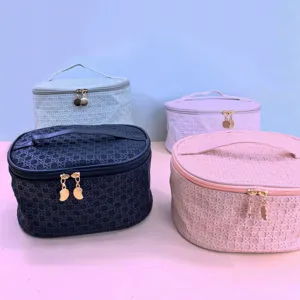 Large capacity PU cosmetic bag with woven texture, portable travel storage pouch and zippers.
