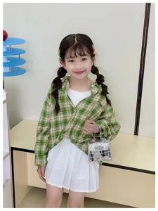 Cute kids plaid shirt with mini silver metallic Kelly handbag and pleated skirt set.