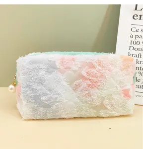 Detailed view of pastel tie-dye cosmetic bag, cute lace fringe pencil pouch, soft storage case.