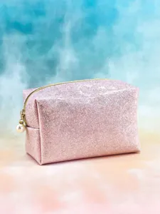 Pink glitter cosmetic bag with gold zipper and pearl charm, portable cute makeup pouch main view.