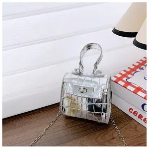Silver laser mini Kelly bag detail view, showing textured PU leather and metallic lock hardware.