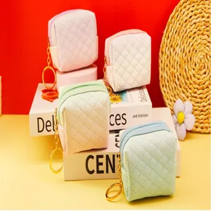 Mini quilted coin purse with cute key chain, colorful zipper pouch for daily storage.