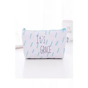 Canvas pencil case detail view showing blue brushstroke pattern, stylish zipper and label.