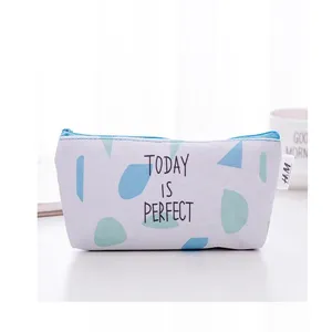 Canvas pencil pouch with blue green abstract shapes and inspiring quote, ideal for students.