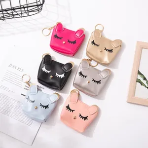 Cute cat ear design mini leather coin purse keychain with lovely eyelash embroidery details.
