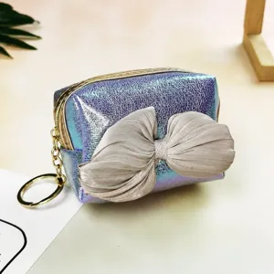 Gradient laser coin purse with bow detail, cute iridescent storage bag close up view.
