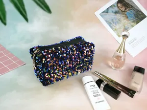 Sparkling sequin cosmetic bag detail view, fashionable travel storage pouch and organizer.