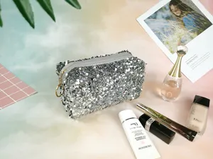 Silver sequin cosmetic bag travel zip pouch portable glitter makeup organizer for women.