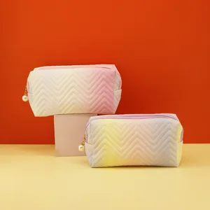 Gradient chevron cosmetic bag with pearl zipper, stylish large capacity makeup organizer pouch.