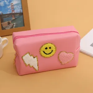 Pink cosmetic bag with cute embroidered patches, large capacity travel makeup pouch for women.