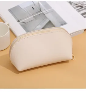 Minimalist double-sided leather cosmetic bag, solid color large capacity portable shell pouch.