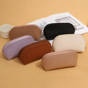 Solid color double-sided leather cosmetic bag large capacity portable shell storage pouch main view