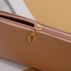 Minimalist leather cosmetic bag zipper detail showing premium double-sided leather texture.