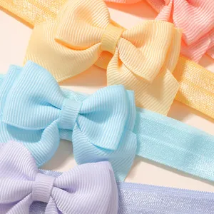Pastel color baby bow headband, soft fabric cute hair accessory for infant girls and toddlers.