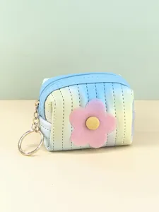 Close-up detail of the mini quilted gradient coin purse featuring a cute flower and key ring.