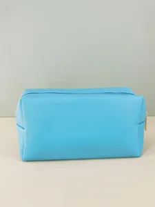 Portable blue PU leather cosmetic bag with zipper, ideal for travel and daily storage.