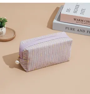 Chic purple tweed cosmetic bag with pearl zipper pull, large capacity portable makeup organizer.