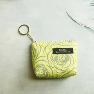Mini yellow coin purse with key ring, cute ruffled floral pattern zipper wallet holder.