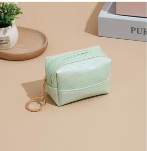 Light green woven PU coin purse with keyring, compact zipper lipstick pouch and accessory.