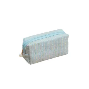 Light blue tweed cosmetic bag with zipper and pearl pendant, large capacity travel pouch.