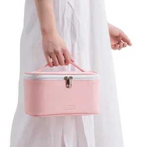 Bolsa cosmética de cuero PU rosa con asa para maquillaje y organización de viajes diarios.