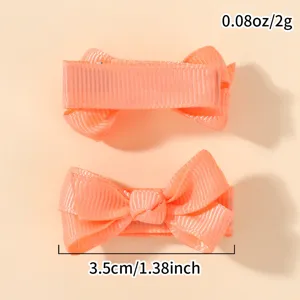 Detailed view of the 3.5cm peach ribbon bow hair clip showing size and weight specs