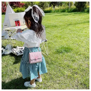 Cute pink mini quilted crossbody bag for girls with heart detail and chain strap