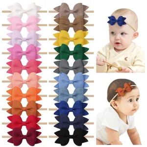 Set de 20 diademas para bebé con lazos de colores, mostradas en modelos, nylon suave