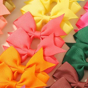 Detailed close-up showing vibrant colors and ribbed texture of boutique grosgrain hair bows