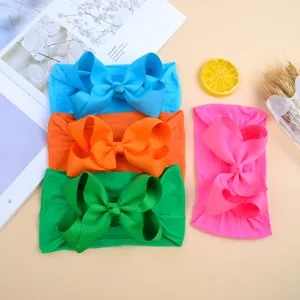 Set of 4 soft nylon baby headbands with large grosgrain ribbon bows in vibrant colors