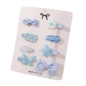 8-piece light blue hair clip set with bows and star designs for girls and babies