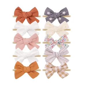 Set van 10 elastische baby-hoofdbanden van nylon met grote stoffen strikken in kleuren