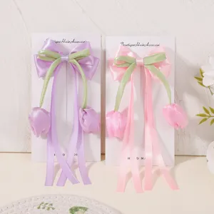 Pinzas para el pelo con lazo de tulipán y cintas largas en rosa y morado pastel