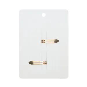 Detail view of two golden gradient BB hair clips on a white display card