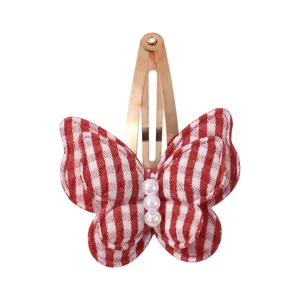 Red and white plaid bow hair clip with pearl detail, cute side clip for girls daily wear.