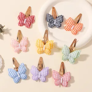 Colorful plaid butterfly hair clips with pearl accents, cute sweet snap clips for kids daily.