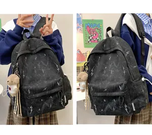 Detailed views of a black lightning bolt backpack with a cute bear charm for students