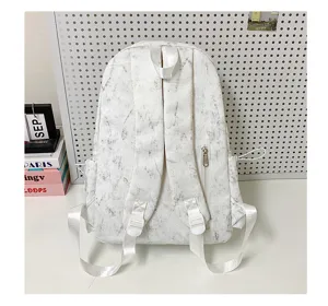 Back view detail of literary white marble pattern backpack with wide shoulder straps