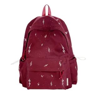 Front view of burgundy student backpack with white lightning pattern and large pocket
