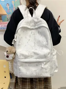 White large capacity school backpack with grey lightning patterns and a cute bear charm