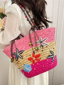 Vibrant multi-color woven straw tote bag with 3D floral accents and beaded straps for summer